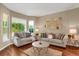 Living room with hardwood floors, two sofas, and a coffee table at 21787 Unbridled Ave, Parker, CO 80138