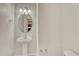 Simple bathroom with a pedestal sink and oval mirror at 750 Vista Verde Hts, Monument, CO 80132