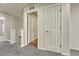 Upstairs hallway with carpet and doors to rooms at 750 Vista Verde Hts, Monument, CO 80132