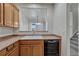 Kitchen features a double sink, dishwasher, and view into the living room at 750 Vista Verde Hts, Monument, CO 80132