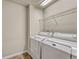 Laundry room with washer, dryer, and shelving at 750 Vista Verde Hts, Monument, CO 80132