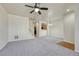 Living room with carpet, ceiling fan, and kitchen view at 750 Vista Verde Hts, Monument, CO 80132