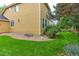 Wide backyard featuring green grass and mature trees around the perimeter of the property at 2631 E 136Th Pl, Thornton, CO 80602