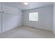 Simple, well-lit bedroom with neutral carpet and a window overlooking the yard at 2631 E 136Th Pl, Thornton, CO 80602
