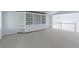 Bright bonus room featuring built-in shelving, railing, and pendant lighting at 2631 E 136Th Pl, Thornton, CO 80602