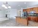 Open-concept kitchen with granite countertops, stainless steel appliances, and access to the living room at 2631 E 136Th Pl, Thornton, CO 80602