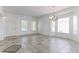 Bright living room boasting tiled floors and ample natural light from large windows at 2631 E 136Th Pl, Thornton, CO 80602