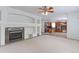 Cozy living room features a fireplace, built-in shelves, and an open layout with nice kitchen access at 2631 E 136Th Pl, Thornton, CO 80602