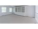 Upstairs loft area featuring neutral carpet, bright light, and built-in shelving at 2631 E 136Th Pl, Thornton, CO 80602