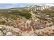 Breathtaking aerial view of resort with stunning mountain backdrop covered in snow and beautiful architecture below at 505 S Main St # 2207, Breckenridge, CO 80424
