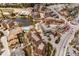 Aerial view of buildings near pond with pool, road, and mountain landscape beyond at 505 S Main St # 2207, Breckenridge, CO 80424