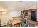 Open concept dining room with wood table and decorative chairs at 505 S Main St # 2207, Breckenridge, CO 80424