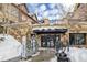 Grand Central stone entrance showcasing ski rental shop and snow covered walkway at 505 S Main St # 2207, Breckenridge, CO 80424