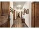 Hallway view features wood flooring and trim plus multiple doors for storage and access to rooms at 505 S Main St # 2207, Breckenridge, CO 80424