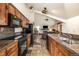Well-equipped kitchen with granite countertops and black appliances at 505 S Main St # 2207, Breckenridge, CO 80424