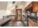 Bright kitchen with balcony access, dark granite counters, and tile floors at 505 S Main St # 2207, Breckenridge, CO 80424