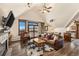 Open living room with vaulted ceiling, balcony, fireplace, and leather sofa at 505 S Main St # 2207, Breckenridge, CO 80424