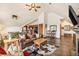 Comfortable living room with leather sofa, TV, and adjoining kitchen at 505 S Main St # 2207, Breckenridge, CO 80424