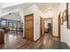 Inviting living room and hallway features hardwood floors and access to a balcony with great views of the nature at 505 S Main St # 2207, Breckenridge, CO 80424