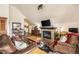 Inviting living room with fireplace, TV, and wood floors at 505 S Main St # 2207, Breckenridge, CO 80424