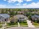 Gorgeous home with a lush green lawn, mature trees, and a paved driveway at 5700 S Benton Cir, Littleton, CO 80123