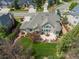 Aerial view of home featuring a large patio, landscaped yard, and manicured lawn at 5700 S Benton Cir, Littleton, CO 80123