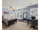 Comfortable bedroom with blue walls, black accents, windows and a desk for studying at 5700 S Benton Cir, Littleton, CO 80123