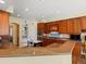This kitchen boasts granite countertops, stainless steel appliances, and a kitchen island with seating at 5700 S Benton Cir, Littleton, CO 80123