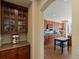 Cherry wood cabinetry and granite countertops define this kitchen, complemented by hardwood floors and an archway entry at 5700 S Benton Cir, Littleton, CO 80123