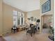 Cozy living room with a fireplace, large windows, and comfortable seating at 5700 S Benton Cir, Littleton, CO 80123