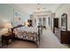 Bright main bedroom with a bay window sitting area and a decorative quilt at 5700 S Benton Cir, Littleton, CO 80123