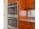Stainless steel double oven and granite countertops create a modern and functional kitchen space at 5700 S Benton Cir, Littleton, CO 80123