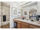 Well-lit bathroom with a spacious vanity, modern fixtures, and walk-in shower at 6240 Everett Ct # F, Arvada, CO 80004