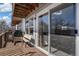 Wooden deck with outdoor seating area accessible through sliding glass doors at 6240 Everett Ct # F, Arvada, CO 80004