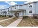 Beautiful townhome with a concrete walkway and manicured lawn at 6240 Everett Ct # F, Arvada, CO 80004