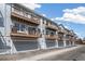 Townhome featuring individual balconies and garage doors at 6240 Everett Ct # F, Arvada, CO 80004