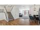 Entryway and open floor plan showing staircase, living room, dining area, and kitchen at 6240 Everett Ct # F, Arvada, CO 80004