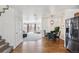 Open floor plan showing living room, dining area, kitchen, and staircase at 6240 Everett Ct # F, Arvada, CO 80004