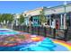 Colorful street view showcasing local businesses, outdoor seating, and vibrant public art in Arvada at 6240 Everett Ct # F, Arvada, CO 80004