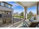 Outdoor balcony with seating, offering serene views of the surrounding neighborhood at 4265 E Iliff Ave # 1, Denver, CO 80222