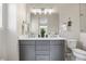 Bathroom featuring double vanity, tile floors, and modern fixtures at 4265 E Iliff Ave # 1, Denver, CO 80222