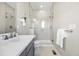 Bathroom featuring tile floors, a glass shower, a modern vanity, and brushed nickel hardware at 4265 E Iliff Ave # 1, Denver, CO 80222