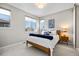 Well-lit bedroom features plush carpet, large windows, and neutral wall color at 4265 E Iliff Ave # 1, Denver, CO 80222