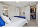 Bedroom showing open sliding door to the bathroom and walk-in closet at 4265 E Iliff Ave # 1, Denver, CO 80222