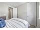 Guest bedroom featuring neutral walls, neutral carpet and white door at 4265 E Iliff Ave # 1, Denver, CO 80222