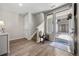 Inviting entryway with wood floors, staircase, and view of the front courtyard at 4265 E Iliff Ave # 1, Denver, CO 80222