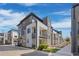Modern townhome exterior featuring balconies, landscaped front yard, and contemporary architectural design at 4265 E Iliff Ave # 1, Denver, CO 80222