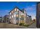 Contemporary townhome exterior with multi-story design, balconies, and modern architectural details at twilight at 4265 E Iliff Ave # 1, Denver, CO 80222