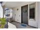 Charming front door entrance with wreath, welcome mat, and modern address numbers at 4265 E Iliff Ave # 1, Denver, CO 80222
