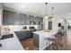 Contemporary kitchen featuring gray cabinetry, marble countertops, and stainless steel appliances at 4265 E Iliff Ave # 1, Denver, CO 80222